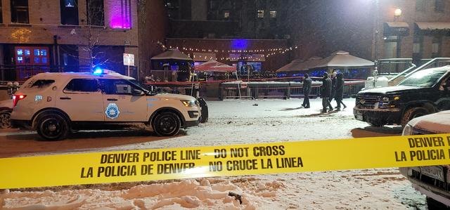 Snowy night crime scene secured with Denver police tape